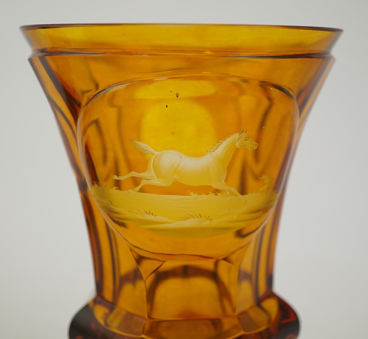 Horse interest - two German amber flashed beakers and two engraved rummers, 19th century
